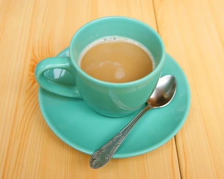 Cup hot coffee on table from tree