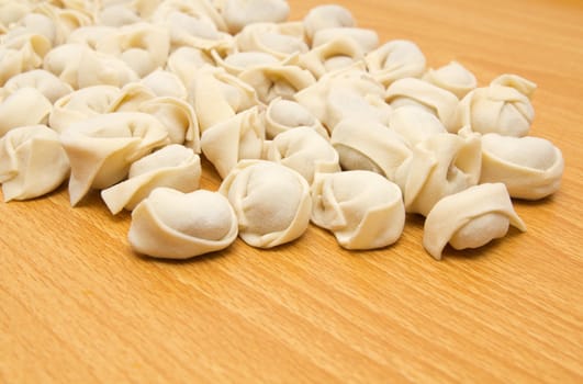 homemade meat dumplings on a cutting board 