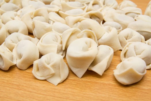 homemade meat dumplings on a cutting board 