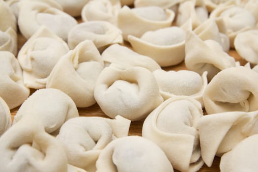 homemade meat dumplings on a cutting board 