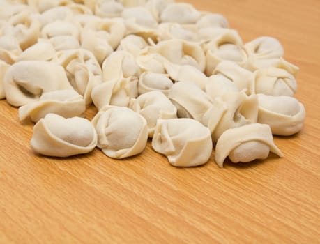 homemade meat dumplings on a cutting board 