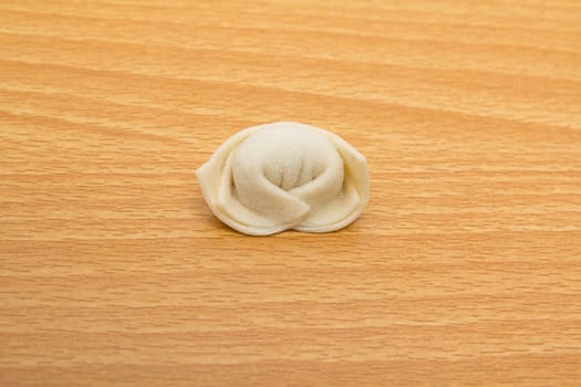 homemade meat dumplings on a cutting board 