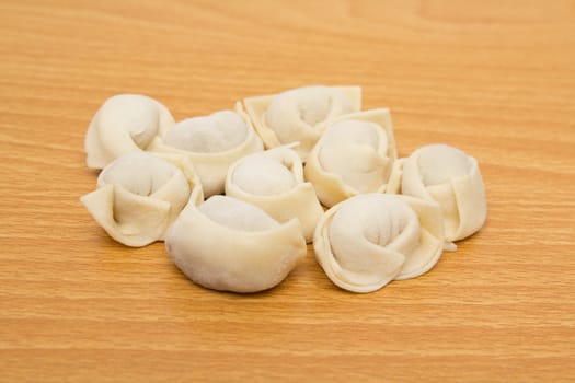 homemade meat dumplings on a cutting board