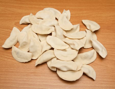 homemade meat dumplings on a cutting board 