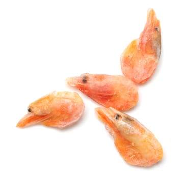 Frozen marine King prawns in a transparent dish 
