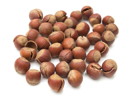 Heap of hazelnuts isolated on white background 