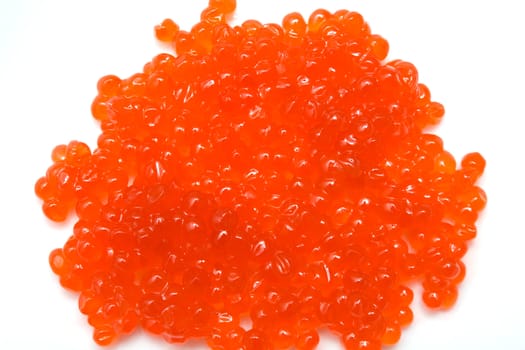 Red salmon caviar heap isolated on white 