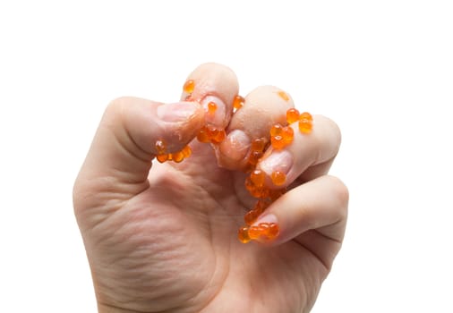 hand in red caviar on white background