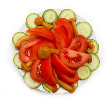 a salad of tomatoes, mushrooms and cucumbers