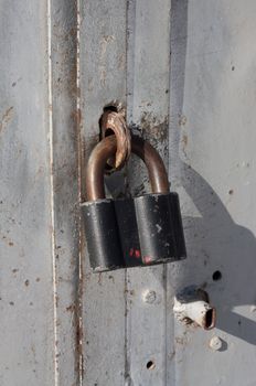 Old rusted garage padlock 