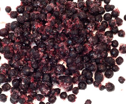 lots of frozen berries (bog whortleberry, cowberries, viburnum) for background 