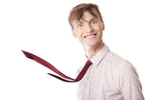 Crazy businessman with flying necktie on a white background