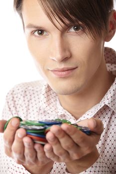 Successful man with casino chips on a white background