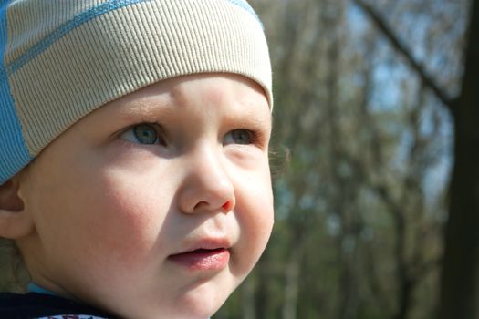 Cute little boy looking away