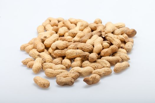 
Dried peanuts in closeup on the white background