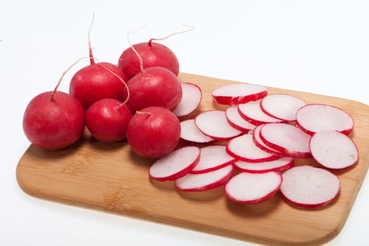 Garden radish on wooden board 