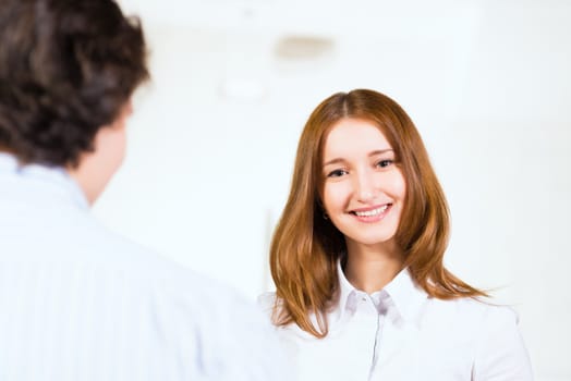 Attractive woman talking with a man, close up portrait