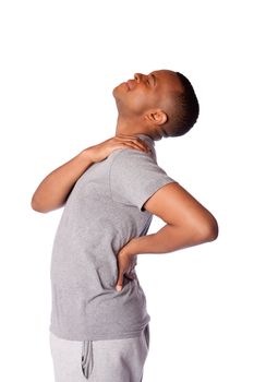 Man with ports injury in back, neck and shoulder pain, tilting head backwards, isolated.
