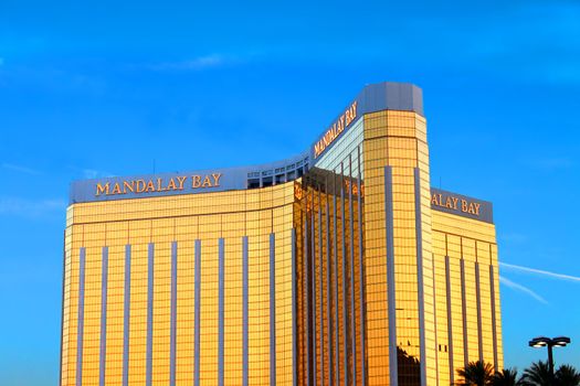 Las Vegas, USA - May 23, 2012: The Mandalay Bay Resort and Casino opened in 1999 in Las Vegas, Nevada.  Seen here is the reflective gold colored exterior of the 44-story tall main building.