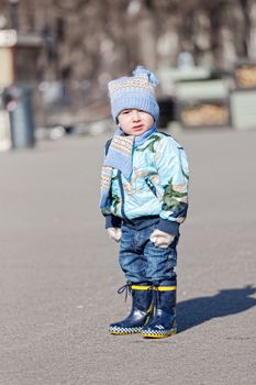 Little boy in rubber boots