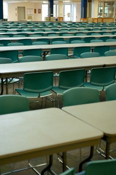 A large classroom with hundreds of seats and tables at a private university