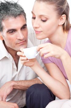 Attractive couple smelling cup of warm coffee