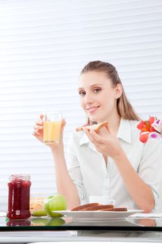 Young woman having healthy breakfast .