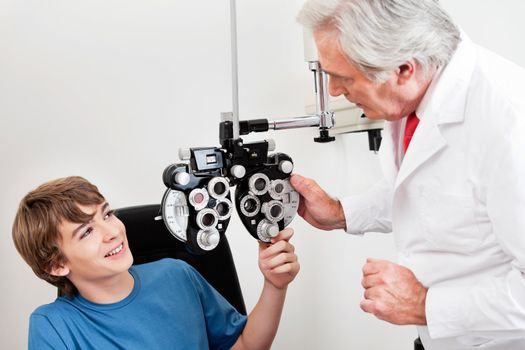 Boy at the optometrist to get his eye test
