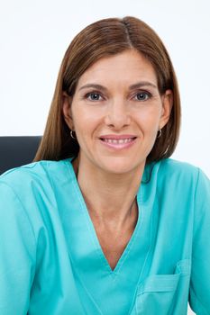 Closeup portrait of female dentist in scrubs smiling