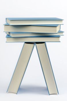 A stack of some closed blue books 