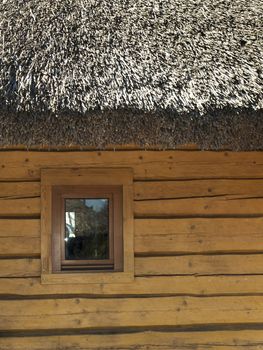 Wooden House With Thatch Roof and Small Window