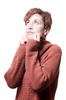 smiling short hair girl cold with orange sweater on white background