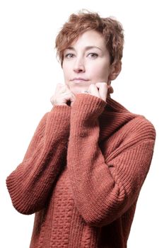 smiling short hair girl cold with orange sweater on white background