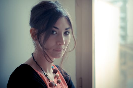 beautiful woman at home near window