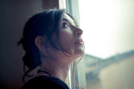 beautiful woman at home near window