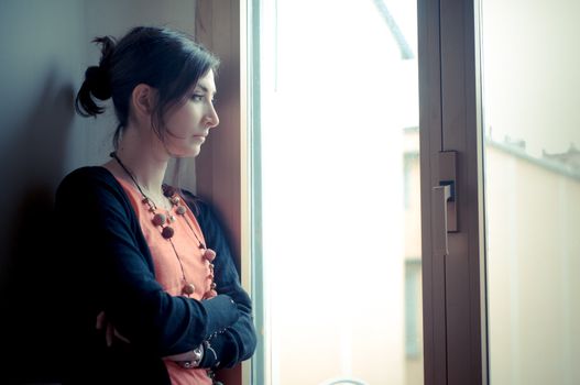 beautiful woman at home near window