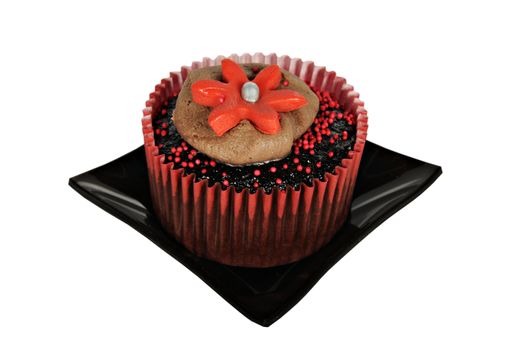 One chocolatecupcake with red icing on a black plate on pure white background