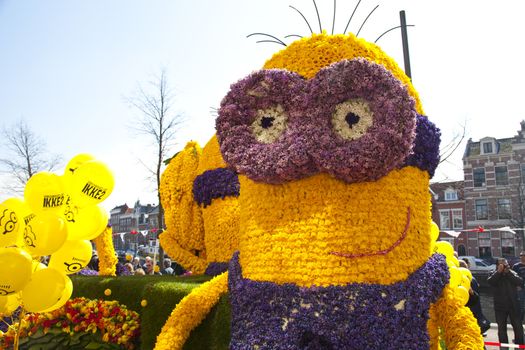 HAARLEM, THE NETHERLANDS - APRIL 21 2013: Despicable character with flowers at flower parade on April 21 2013 in Haarlem, The Netherlands. The annual flower parade is a unique event with one million visitors. 