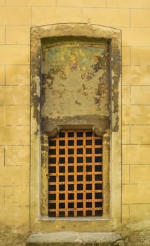 medieval church door on yellow wall