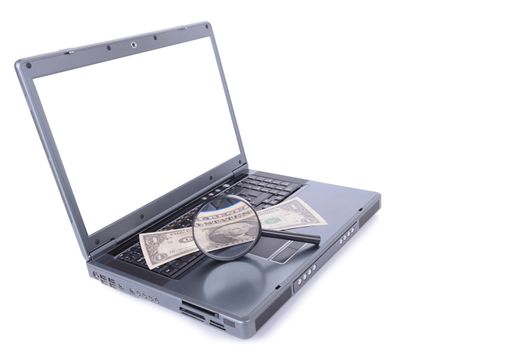 laptop with a streached dollar concept of making money go further magnifed by a magnifying glass,  spherical aberration on the dollar. isolated on white background including clipping path