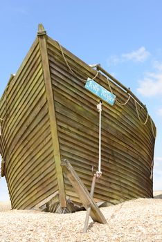 the jolly roger pirate ship with blue sky backgound