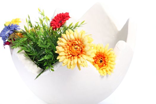 large egg decorated with flowers on white background