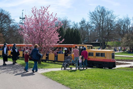STUTTGART, GERMANY - April 14, 2013: People are enjoying the first sunny spring day in Killesberg Park in Stuttgart, Germany on April 14, 2013. Killesberg Park was opened 1939 and is with its about 50 hectares an important recreation area for inhabitants and a great sight for tourists of Stuttgart.