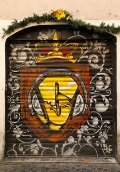 Graffiti art on doors in Rome street