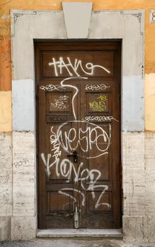 Graffiti art on doors in Rome street