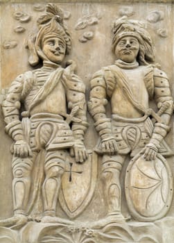 Two knights - house sign on Gothic house in Kutna Hora - famous city in Czech republic
