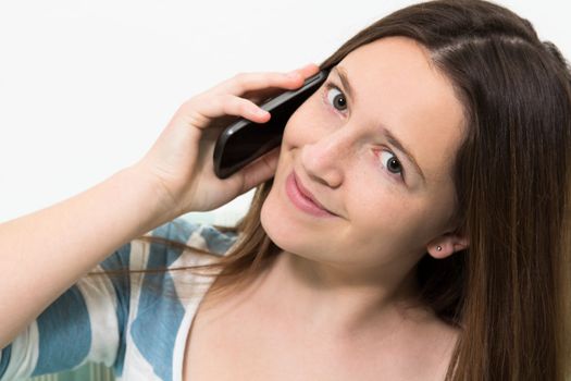 Young brunette girl with a blue and white striped top talking on the phone