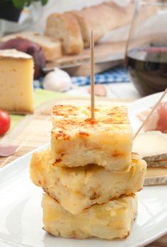 Closeup of a potato omelette on a platter