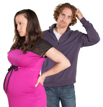 Man next to pregnant woman scratching his head