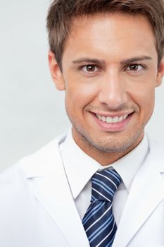 Closeup portrait of male dentist smiling